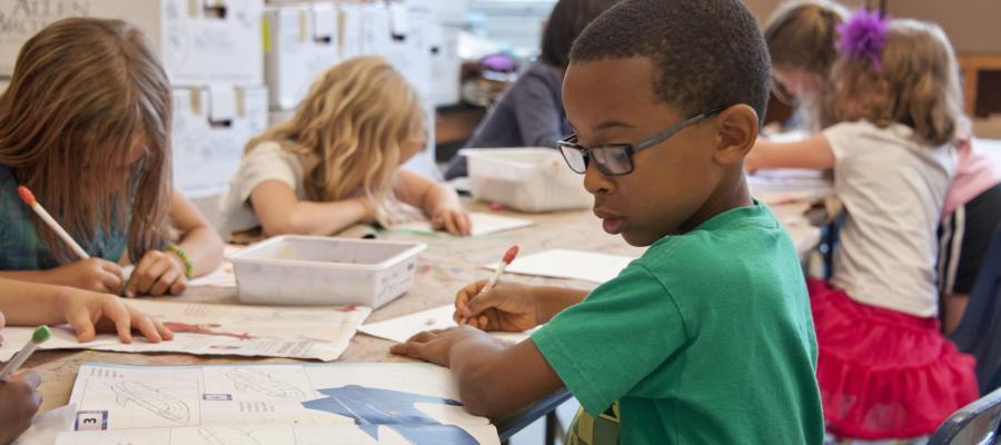 Child doing schoolwork in classroom