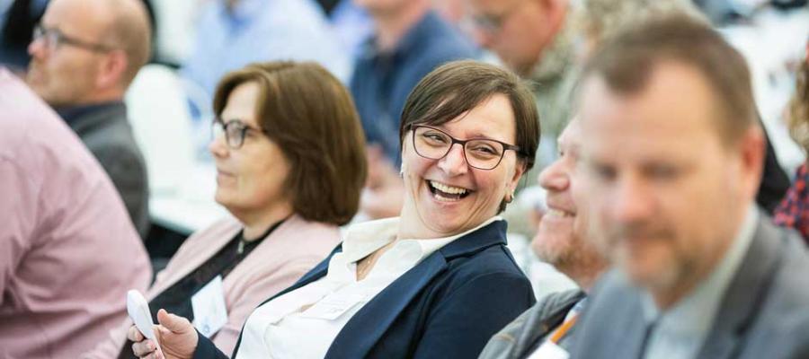 Woman in conference crowd