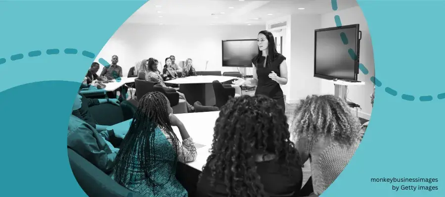 Woman talking at the front of a classroom