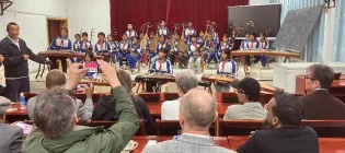 Attendees enjoying a performance at the conference 