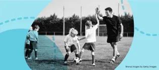 Coach and kids playing football