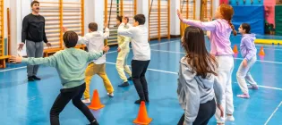 Teacher and class in PE lesson