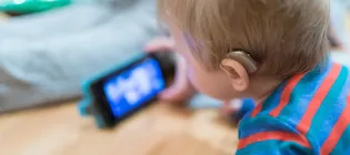 IE-DeafEd2-Hearing-Aid-on-Baby-900x400.jpg