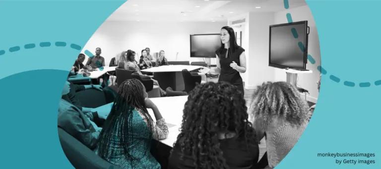 Woman talking at the front of a classroom