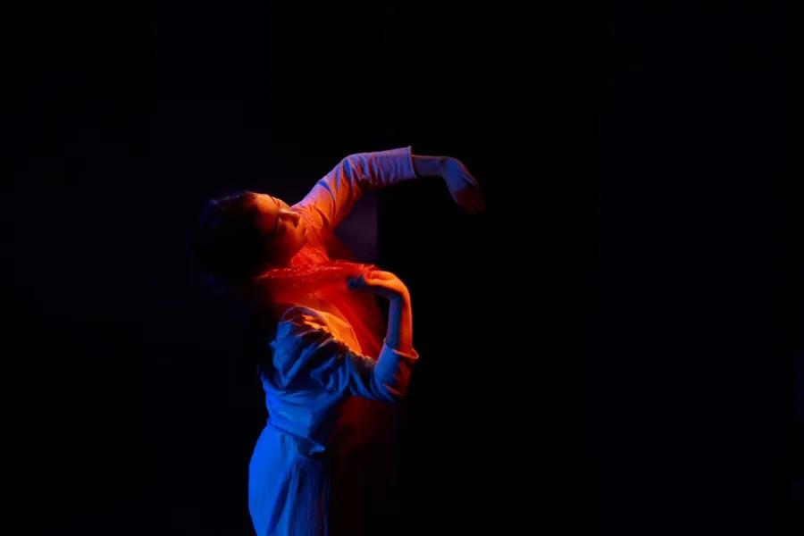 Dancer performing against a black background
