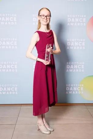 Rachel holding the award she received at the Scottish Dance Awards