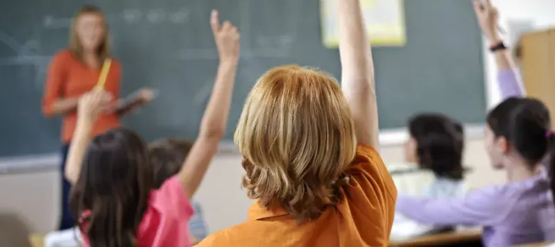 Children with their hands up