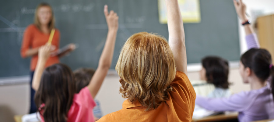 Children with their hands up