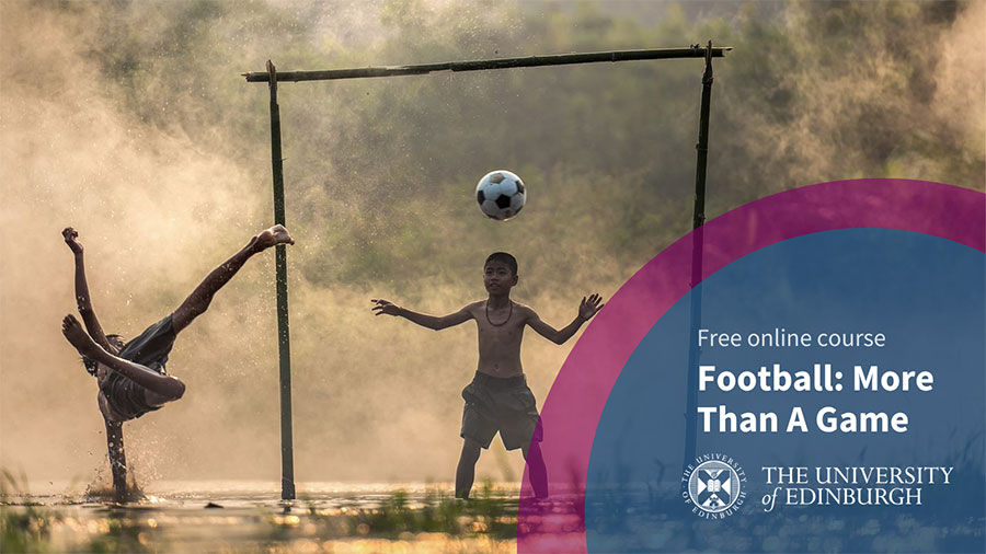 Two boys playing football