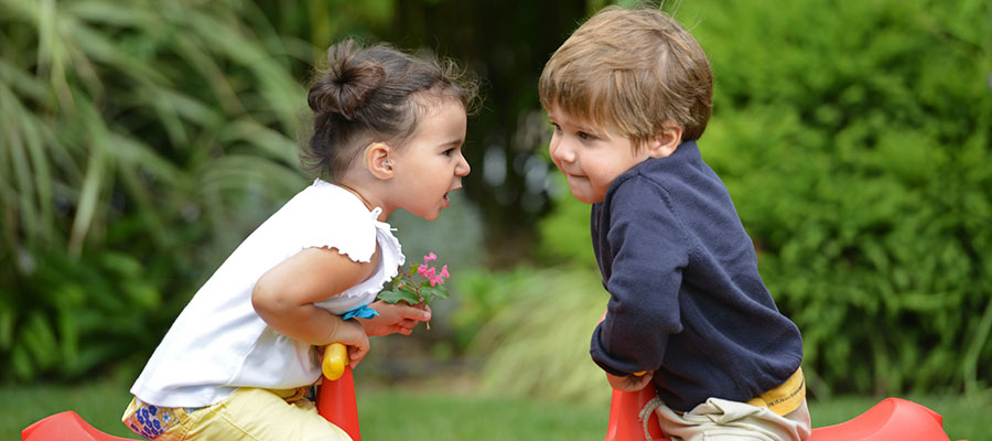 Two children with hearing aids