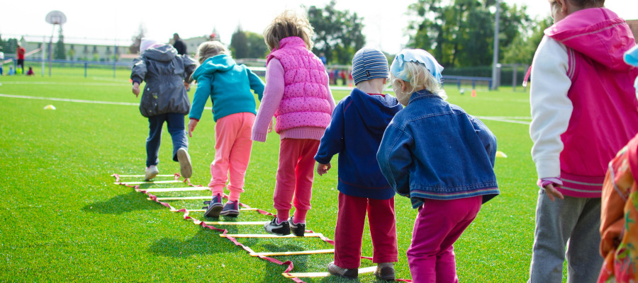 Children playing a jumping game