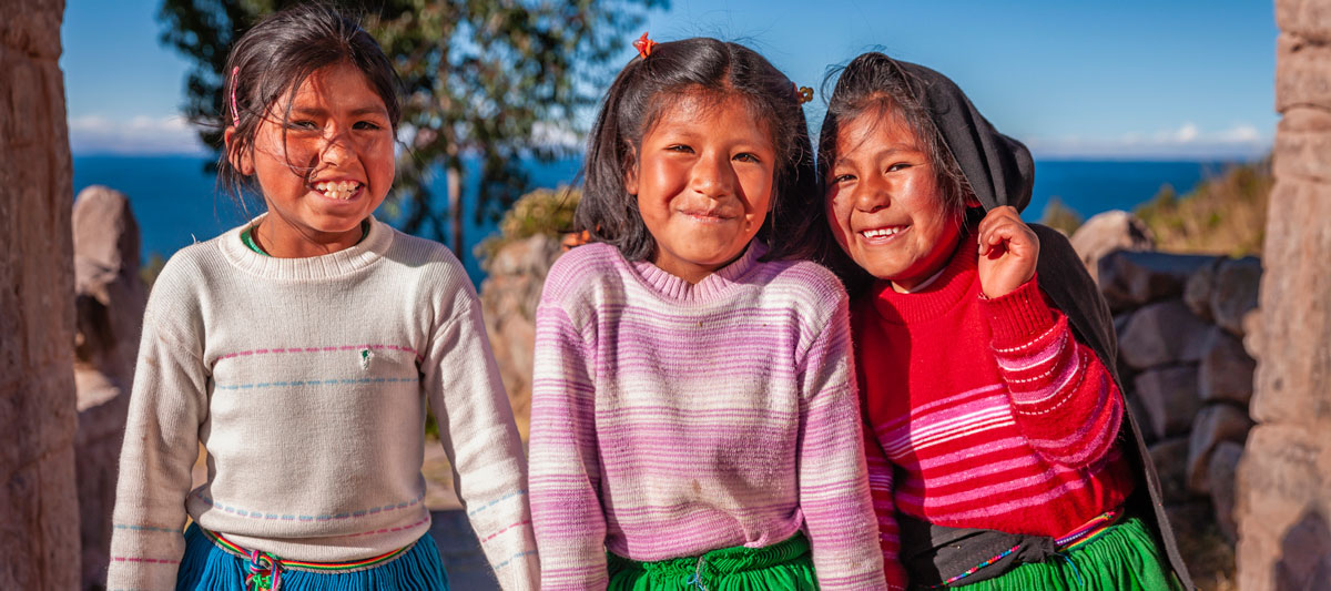 Photo of three happy children